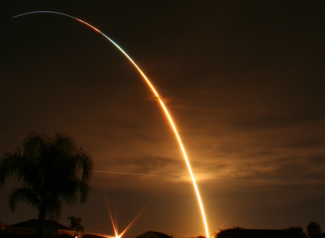 Rocket disappearing into dawn sky